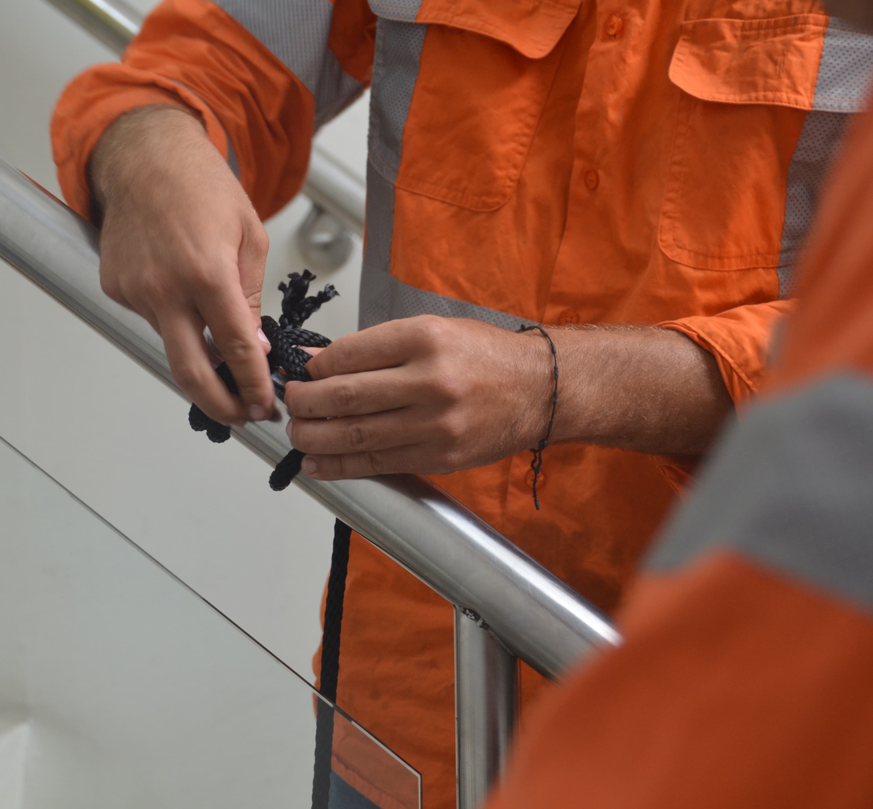 Trainee practicing rope knotting during YRT safety training.
